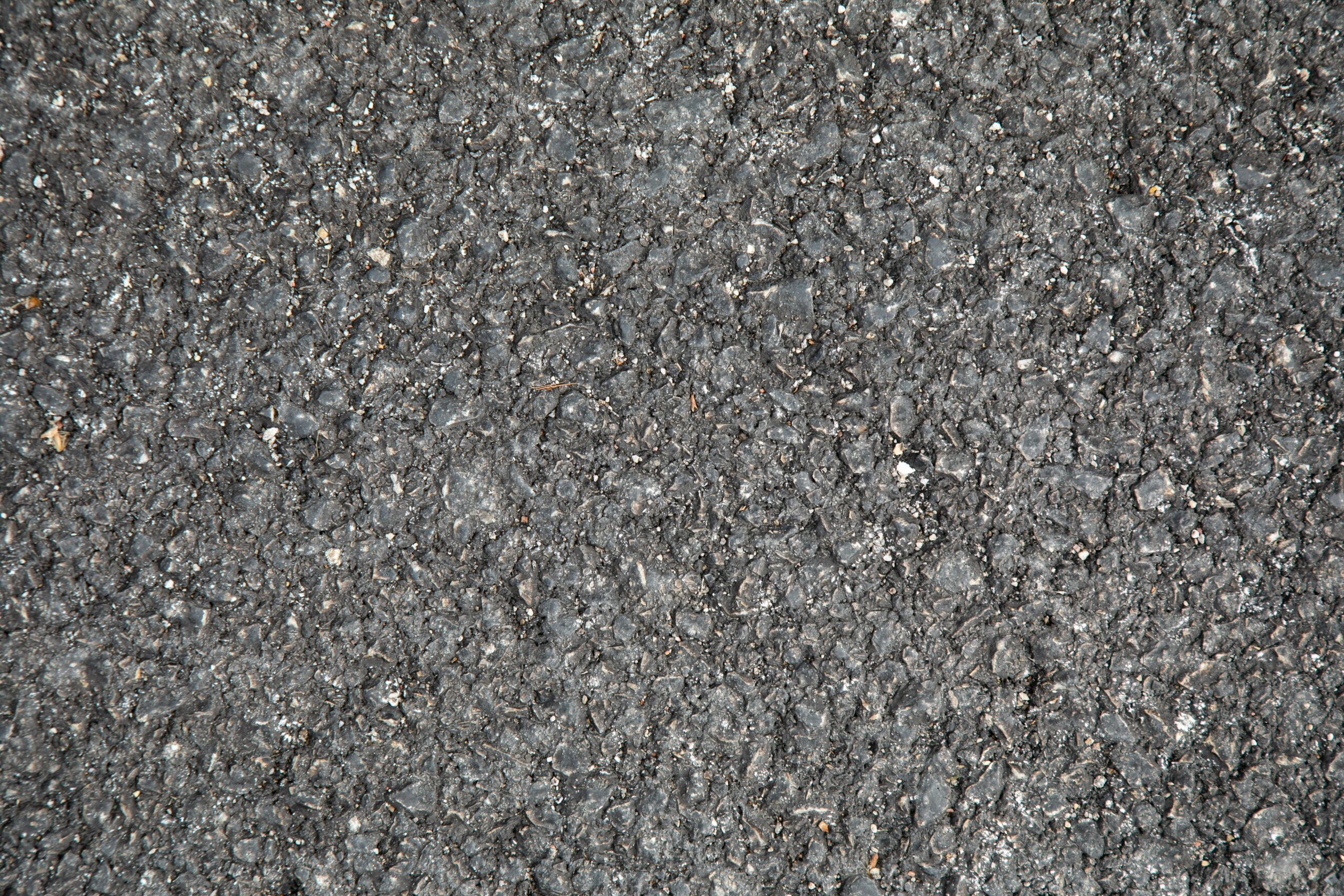 Close up of asphalt reflecting our asphalt repair Colorado Springs services.
